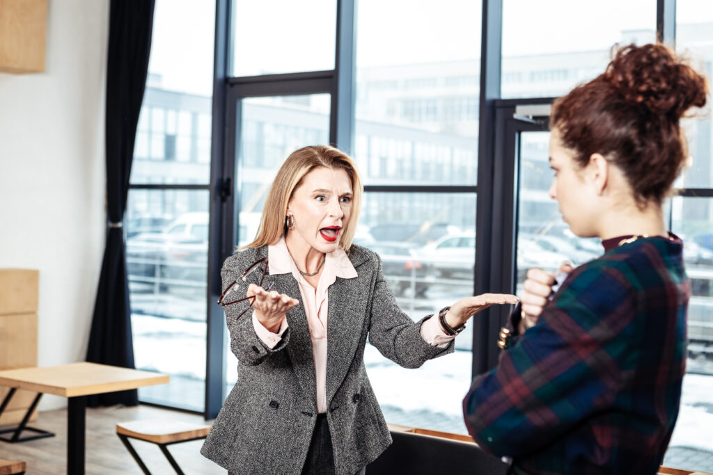 Over controlling female boss yelling at employee.